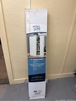 Full view of unopened box with full product details and image of assembled cabinet.