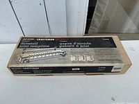 Top view of the box showing Sears Craftsman branding and illustration of the dovetail joint template and its parts.