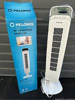 Full view of the Pelonis tower fan next to original product box showing brand name and key features