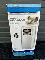 Front view of the unopened Garrison portable air conditioner box showing the product image, brand and BTU rating.