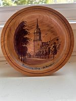 Wooden decorative plate with engraved image of Annaberg/Erzg. St. Annen village showing tower and trees