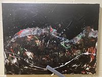 Full view of the large abstract oil painting showing mostly black surface with multicolor textured strokes.