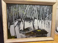 Framed oil painting showing abstract or natural scene with herbs and water reflections, signed by artist