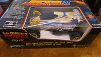 Photo of the Packal Fox RC car in original packaging with labeling showing model and design.