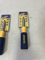 Two Irwin 9-in-1 screwdrivers new in their packaging on a light surface.