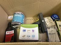 Box contents showing Barge All-Purpose Cement, Stans Tire Sealant, AGPTek air pump, handheld device and other items