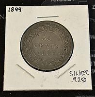 Reverse photo of 1899 Newfoundland 50 cents silver coin with date and denomination, showing silver purity noted on holder.