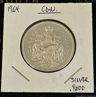 Obverse side showing Canadian coat of arms and denomination.