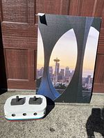 Canvas print showing Seattle Space Needle in sunset lighting framed by architectural curves.