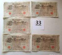 Five 1000 mark Reichsbanknotes laid out flat for review, showing overall condition and design.