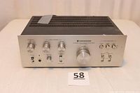 Front view of Kenwood KA-3500 amplifier showing all control knobs and switches with an auction lot number in front.