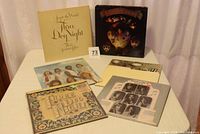 Six original Three Dog Night vinyl albums displayed on a table with album covers visible, showing band members and album artwork from the early 1970s.