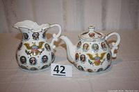 Front view of teapot and pitcher showing president portraits and American eagle crest.