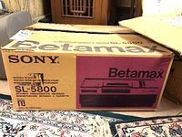 Original Sony Betamax SL-5800 box with purple and yellow graphics showing model and features.