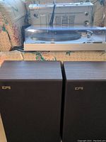 Full setup showing Technics turntable, receiver, and EPI speakers arranged on a couch.