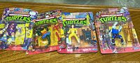 Overview of four sealed TMNT action figures in blister cards.