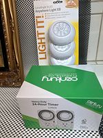 Box of Century Heavy Duty 24-Hour Timer 2-Pack with green and white packaging showing the product image.