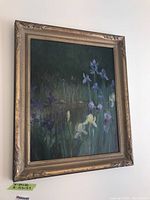 Framed floral painting on board hung on wall, shows overall artwork and frame