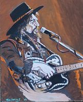 Close-up image of the original painting showing a musician with black hat, guitar, and microphone, signed by artist Thomas, dated 2019.