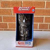 Frontal photo of the boxed DC Comics Justice League Batman tiki mug showing the mug design clearly through the boxed window.