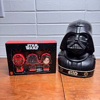 Photo of boxed Dark Side Saga keychains and Darth Vader gum head