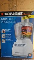 Photo of the boxed Black & Decker 8-Cup Food Processor showing product image and branding on box.
