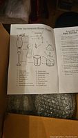 Instruction manual showing parts and assembly of immersion blender and attachments