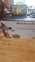 Box showing KitchenAid Spiralizer Plus with peel, core, and slice attachments, 7 blades.