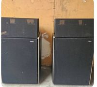 Full view of both Technics SB-7000A speakers showing overall size and condition, front-facing with black fabric covers.