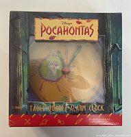 Front of original packaging showing Disney's Pocahontas branding and the clock face.