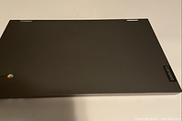 Closed top view showing exterior finish and Lenovo and Chrome branding