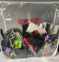 Plastic Teck Deck skateboarding skatepark parts including ramp, rails, and platforms inside a clear plastic zip bag.