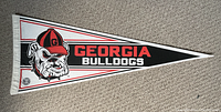 Clear top-down image of the vintage Georgia Bulldogs pennant showing the design and condition