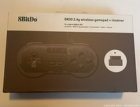 8BitDo SN30 wireless gamepad box showing model and contents description.
