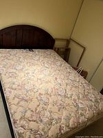 Assembled queen bed with headboard, mattress and frame