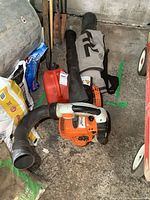 Overall view of blower unit with tubes and fuel can in storage area