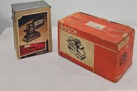 Photo of both sanders in their original boxes with seller's suggested brands and model types visible.