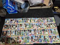 Layout of about 60 of the 1976 Topps baseball cards showing player portraits and action images with team logos and card details.