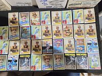Photo showing 35 baseball cards mostly featuring Rollie Fingers in Milwaukee Brewers and San Diego Padres uniforms.