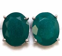 Close-up front view of matched pair of oval faceted green onyx earrings set in sterling silver prong mounts.