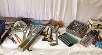 Overview of assorted tools including circular saw, clamps, socket sets and hand tools