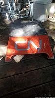 Front view showing CN logo on side and rubber tread on top