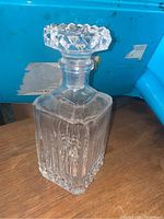 Clear view of the full decanter showing the geometric pattern and square stopper.