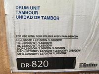 Box of a new Brother DR-820 drum unit showing compatible printer models and product labeling.
