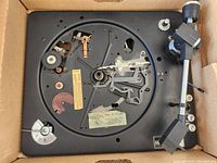 Top view of the vintage ELAC Miracord 45 turntable showing all mechanical parts and tonearm in black color.
