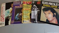 Five Elvis Presley magazines laid out, front cover visible for four