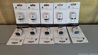 Wide shot showing all 10 USB wall chargers in original packaging with identical appearance and branding.