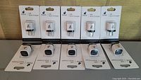 Front view of 10 iPlanet USB wall chargers in original packaging showing brand and product name