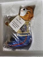 Bear figurine in original styrofoam packaging, tagged 'Always Faithful' U.S.M.C. collection
