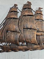 Front view of the copper ship boat wall hanger showing detailed sails and rigging with an antique finish.